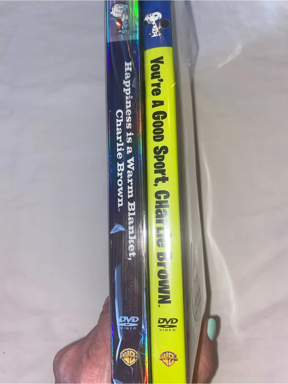 2 Snoopy/Peanuts DVD’s